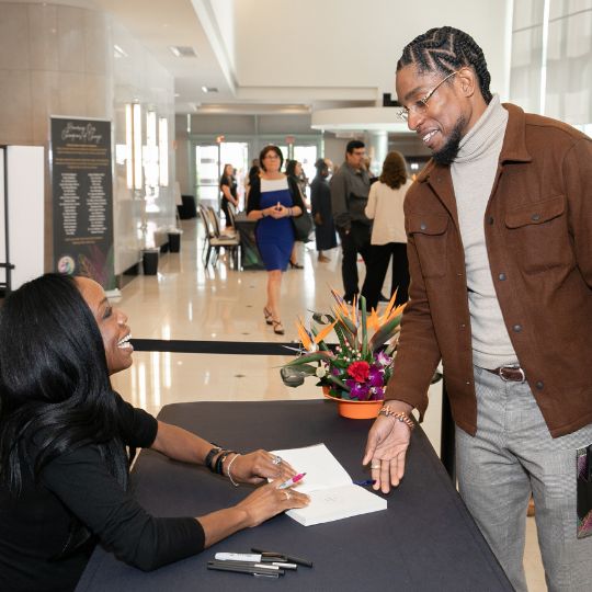 Dr. Burke Harris event signage