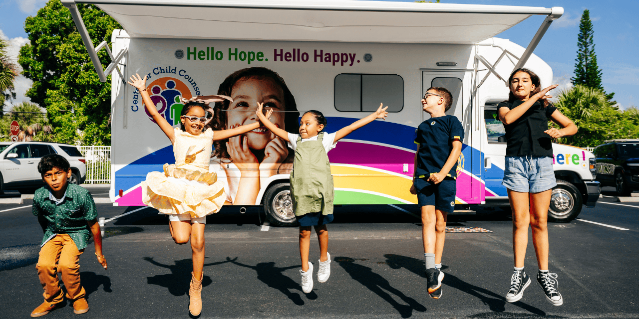 Children celebrating at the Mobile HOPE Unit — Center for Child Counseling