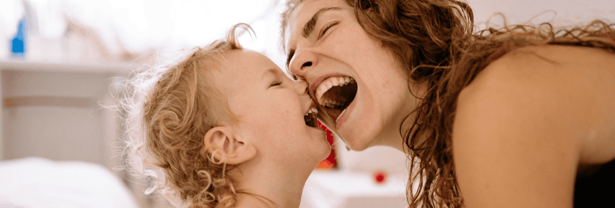 Babies and families laughing together at Celebrate Babies